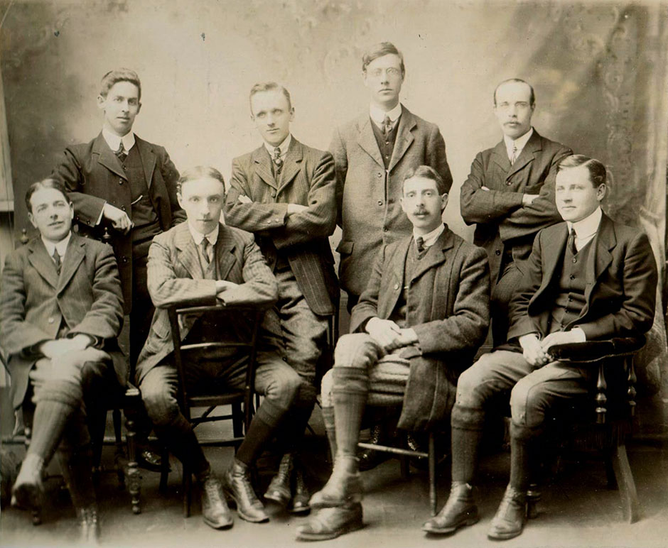 A group of Excise staff with Stewart child sitting third from the left.